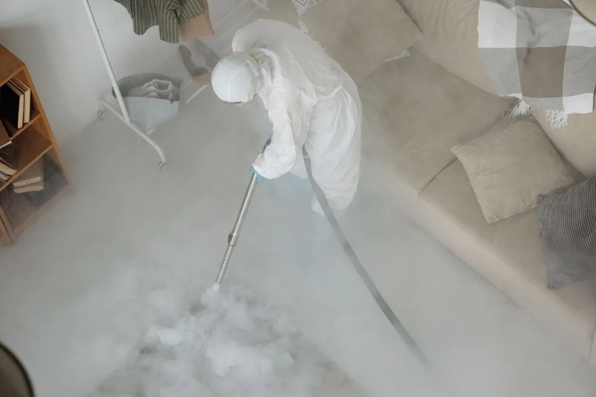 Biohazard cleanup technician in protective equipment, Melcher-Dallas, IA